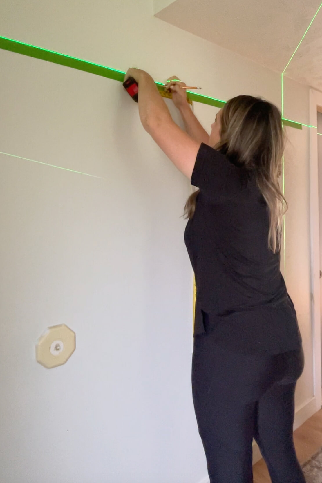 Measuring for center of wall to hang a gallery wall.